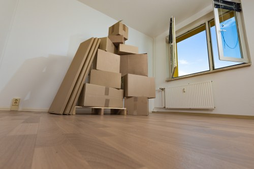 Removal team planning a house move in West Hampstead street setting