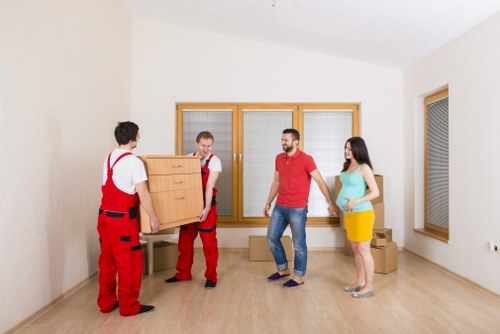 Packed boxes and a desk ready for transport during a local student relocation