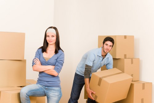 Local moving team handling furniture in a West Hampstead flat