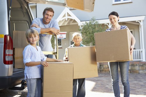 Packed boxes and furniture ready for transport by a West Hampstead man and van
