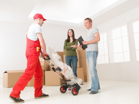 Removal team planning a move in West Hampstead residential street