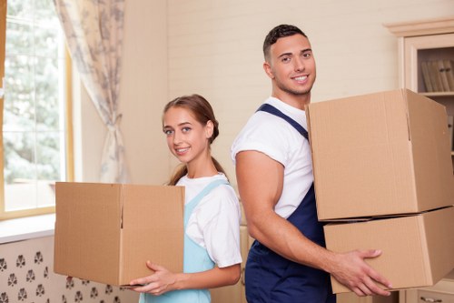 Movers handling stairs and access challenges during a Westhampstead flat move