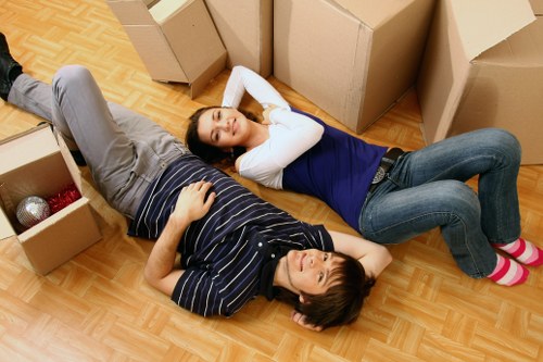 Mover handling furniture carefully during a professional removal service